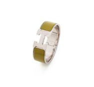 HERMÈS, 'CLIC CLAC H', AN OLIVE GREEN HINGED BANGLE