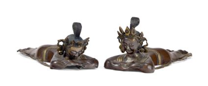 A PAIR OF PARCEL GILT BRONZE FIGURES OF WORSHIPING ATTENDANTS, TIBETAN, 17TH CENTURY
