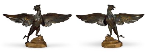 CIRCLE OF EUGENE VIOLLET-LE-DUC (1814-1879)- AN UNUSUAL PAIR OF GILT BRONZE GRIFFINS