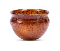 AN ANCIENT ROMAN AMBER GLASS BOWL, CIRCA 4TH CENTURY A.D.