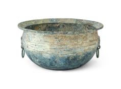 A large Chinese bronze inscribed circular water vessel