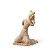 A Chinese pottery model of a dancer