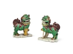A pair of Sancai-glazed biscuit models of Buddhist lions