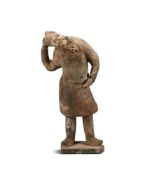 An unusual Chinese pottery figure of a bearded man