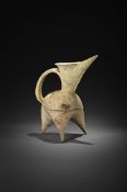 A Chinese white pottery tripod ewer