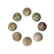 A group of eight Chinese gilt bronze circular buckles