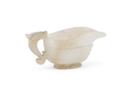 A Chinese pale celadon jade libation cup