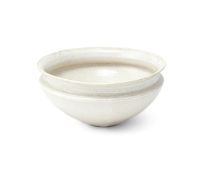 A Chinese white glazed 'alms' bowl