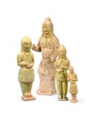 A group of four various Chinese yellow glazed models of soldiers