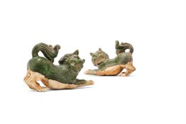 A pair of Chinese green glazed models of lions