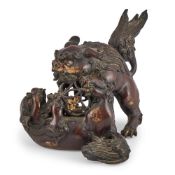 A Japanese gilt-bronze okimono of shishi lion