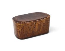 A small Chinese amber glazed marbled pillow