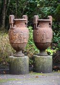 AFTER THE ANTIQUE, A PAIR OF CAST IRON 'SOSIBOS' KRATER GARDEN URNS, 19TH CENTURY