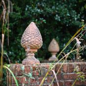 A PAIR OF TERRACOTTA 'PINECONE' FINIALS, 20TH CENTURY