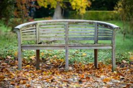A HARDWOOD GARDEN BENCH, MODERN