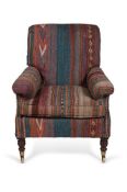 A MAHOGANY AND KILIM UPHOLSTERED 'WILLOUGHBY' ARMCHAIR, BY HOWARD & SONS