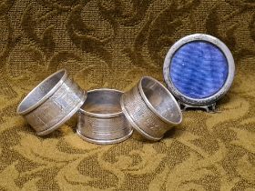 3 silver napkin rings and a small silver photo frame