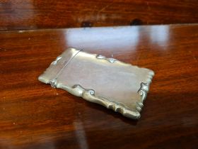 Silver card case with scrolled decoration