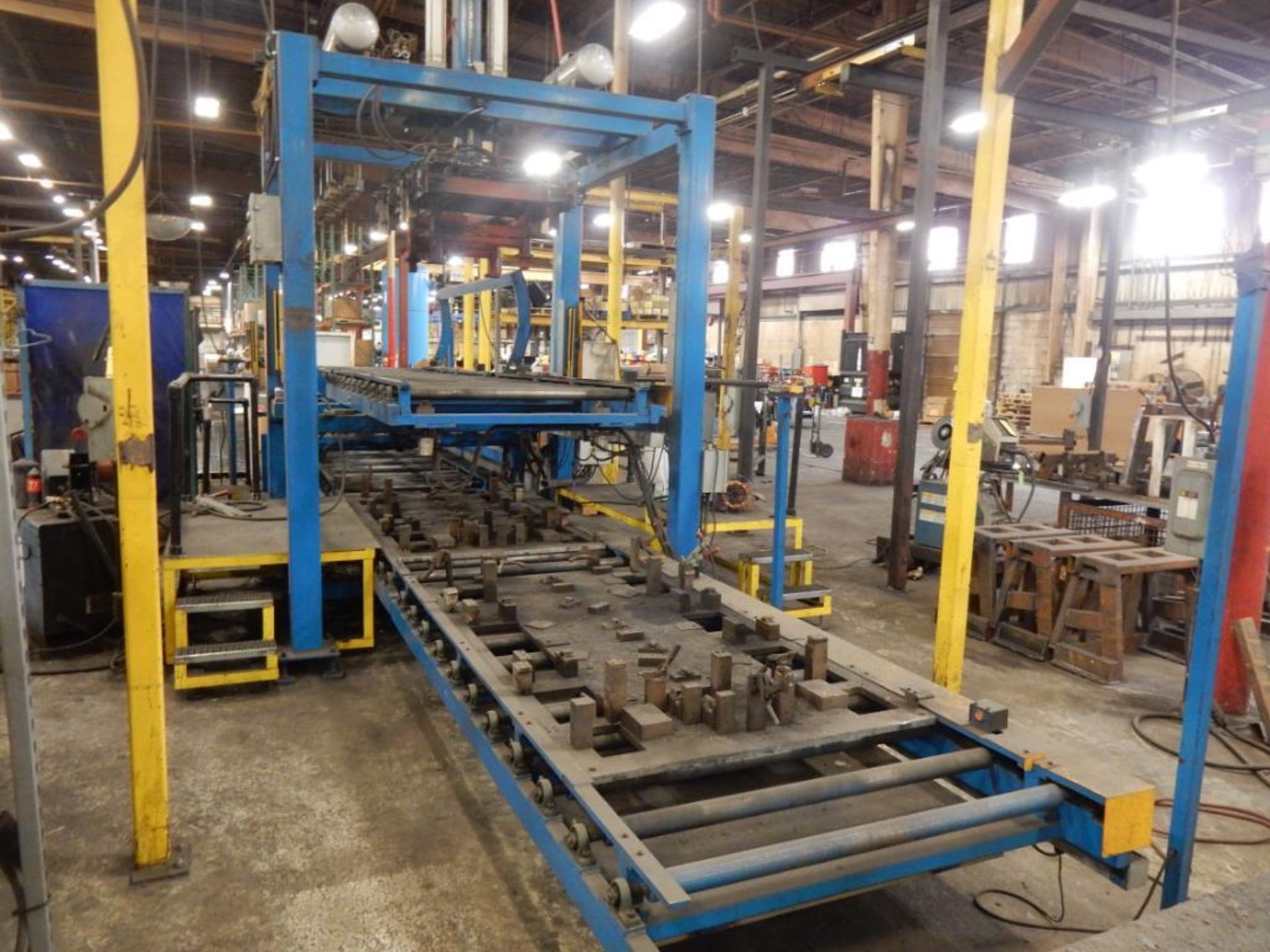 LOT (2) LOAD/UNLOAD STATIONS, CUSTOM BUILT, PNEUMATIC LIFTER, CONVEYOR ROLLERS, STAIRS, ETC.