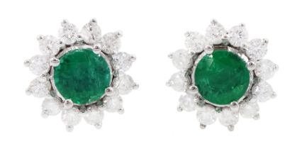 Pair of 18ct white gold emerald and round brilliant cut diamond cluster stud earrings