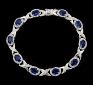 Silver cubic zirconia and blue stone set bracelet