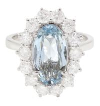 18ct white gold oval aquamarine and round brilliant cut diamond cluster ring