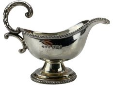 Small silver sauce boat with gadrooned edge