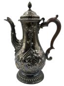 George III silver coffee pot with later embossed decoration of flowers and leaves