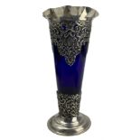 Late Victorian silver overlaid blue glass trumpet shape vase with crimped rim