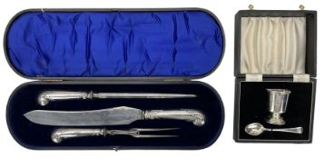 Edwardian three piece carving set with silver pistol handles and in fitted case with presentation pl