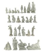 Group of twenty six white porcelain figures