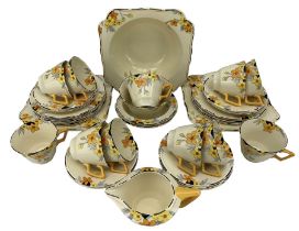 Crown Ducal Sunburst pattern Art Deco tea set comprising eleven cups
