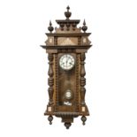 German - mid 19th century spring driven 8-day wall clock in an oak and mahogany case