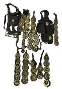 Quantity of vintage leather horse tack including head collar and martingales etc hung with various b