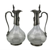 Pair of French glass and pewter mounted claret jugs