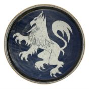 Studio pottery charger decorated with a rampant lion