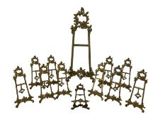 Set of eleven ornate brass picture easels