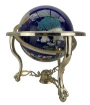 Table top terrestrial globe inset with semi-precious stones on a blue ground in metal frame with com