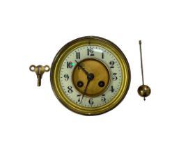 French clock movement housed in a wooden case with pendulum and key.