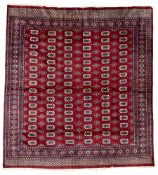 Persian Bokhara claret ground rug