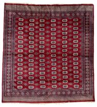 Persian Bokhara claret ground rug