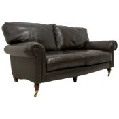 Traditional shape two seat sofa upholstered in brown leather