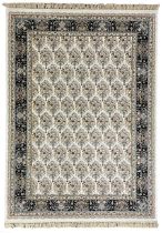 Persian design densely knotted ivory ground carpet