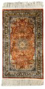 Fine Persian amber ground rug