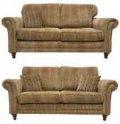 Mayfair - pair of 'Tara' hardwood framed two-seat sofas upholstered in foliate pattern fabric