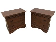 Pair of walnut finish two-drawer bedside chests
