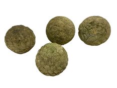 Collection of four cast stone garden sphere ornaments