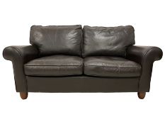 Two-seat traditional shaped sofa upholstered in brown leather