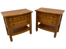 Pair of oak and pine finish bow-front bedside stands