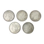 Five United States of America silver Morgan dollar coins